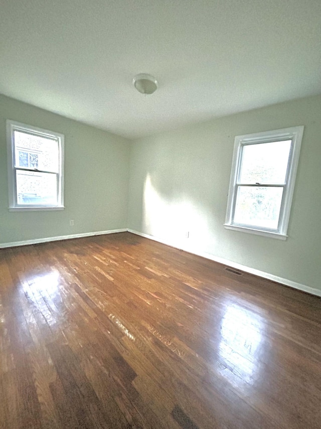 324 Glendale Ave, Lexington, KY 40511 - spare room featuring wood finished floors, plenty of natural light, and baseboards