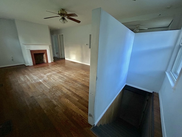 324 Glendale Ave, Lexington, KY 40511 - unfurnished living room with a ceiling fan, wood finished floors, baseboards, and a brick fireplace