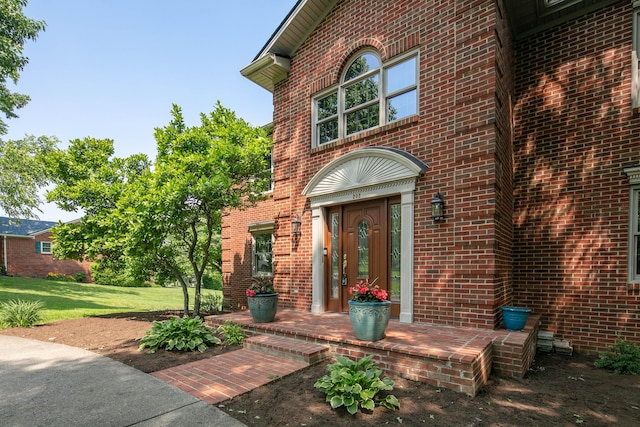 202 Thoroughbred Ln, Nicholasville, KY 40356 - view of exterior entry with brick siding and a lawn