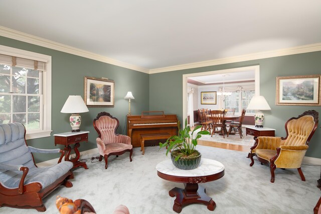 202 Thoroughbred Ln, Nicholasville, KY 40356 - sitting room with plenty of natural light, ornamental molding, baseboards, a chandelier, and carpet