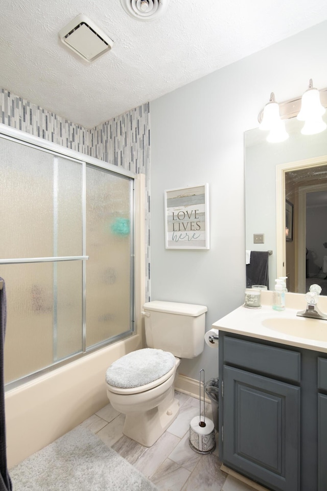 202 Thoroughbred Ln, Nicholasville, KY 40356 - bathroom with toilet, vanity, shower / bath combination with glass door, and a textured ceiling