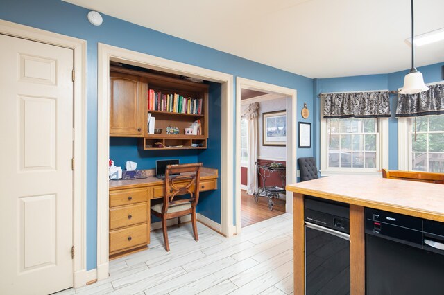 202 Thoroughbred Ln, Nicholasville, KY 40356 - office space with light wood-style floors, built in desk, and baseboards