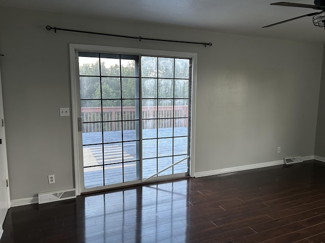 522 Countryside Cir, Mount Vernon, KY 40456 - unfurnished room featuring baseboards, a ceiling fan, and dark wood-style floors