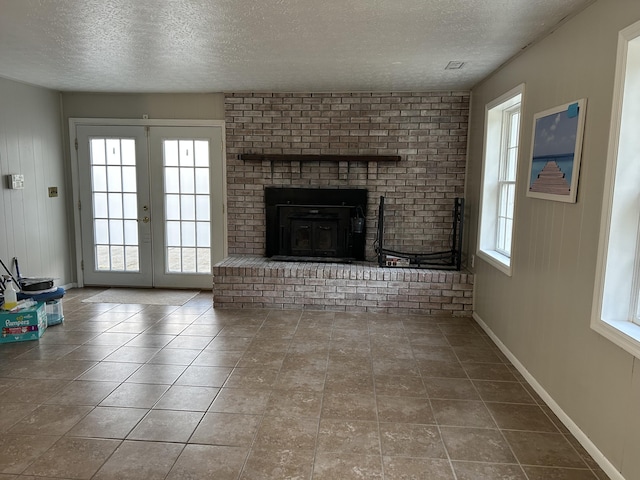 522 Countryside Cir, Mount Vernon, KY 40456 - unfurnished living room with a textured ceiling, french doors, baseboards, and tile patterned flooring