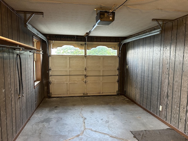522 Countryside Cir, Mount Vernon, KY 40456 - garage with a garage door opener, wooden walls, and baseboards