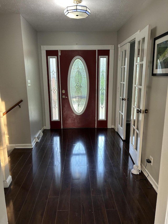 522 Countryside Cir, Mount Vernon, KY 40456 - entrance foyer featuring a textured ceiling, wood finished floors, baseboards, and french doors