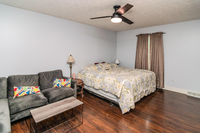 50 Barnett St, Hustonville, KY 40437 - bedroom featuring wood finished floors, a textured ceiling, and a ceiling fan