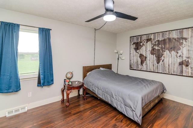 50 Barnett St, Hustonville, KY 40437 - bedroom with wood finished floors, a textured ceiling, and ceiling fan
