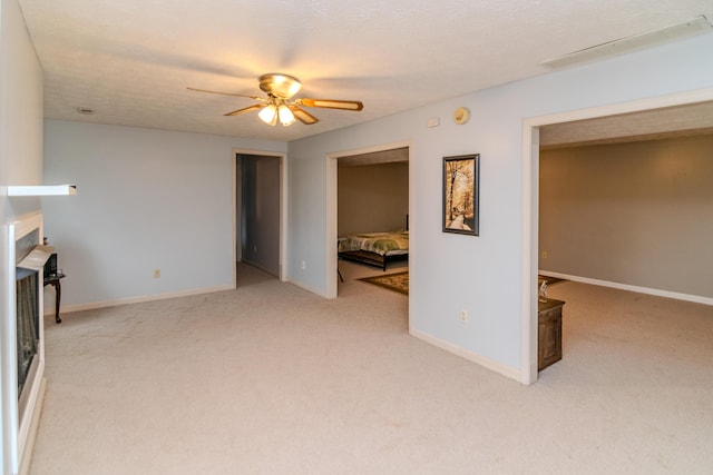 50 Barnett St, Hustonville, KY 40437 - unfurnished living room with light colored carpet and a ceiling fan