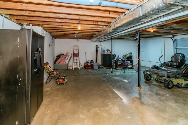 50 Barnett St, Hustonville, KY 40437 - basement featuring black fridge with ice dispenser