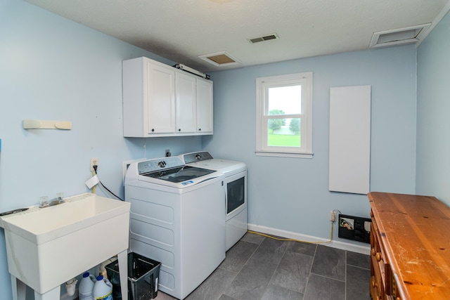 50 Barnett St, Hustonville, KY 40437 - laundry area featuring attic access, cabinet space, and washing machine and clothes dryer