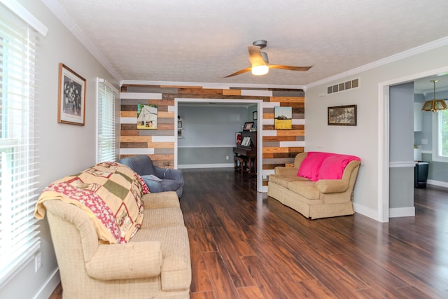 50 Barnett St, Hustonville, KY 40437 - living room with crown molding, ceiling fan, wood finished floors, and a textured ceiling