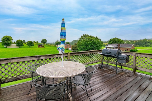 50 Barnett St, Hustonville, KY 40437 - deck featuring outdoor dining space, area for grilling, and a yard