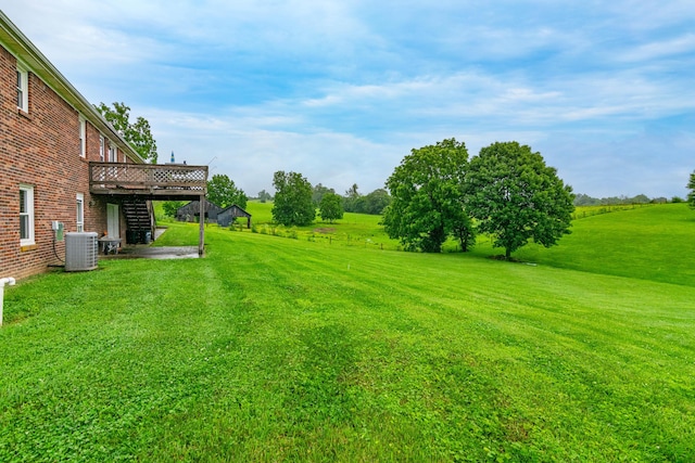 50 Barnett St, Hustonville, KY 40437 - view of green lawn with a deck and stairs