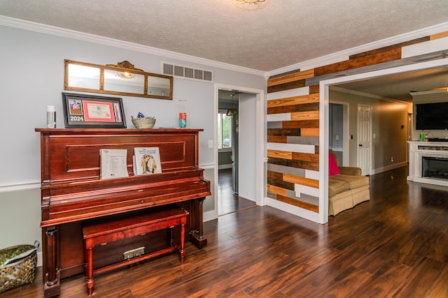 50 Barnett St, Hustonville, KY 40437 - living area with ornamental molding, wood finished floors, a fireplace, a textured ceiling, and wood walls