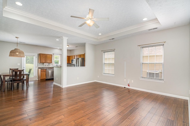110 Seth Way, Georgetown, KY 40324 - unfurnished living room with a raised ceiling, ornamental molding, dark wood-style flooring, ceiling fan, and plenty of natural light