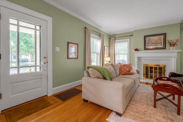 406 Dudley Rd, Lexington, KY 40502 - living area with light wood-type flooring, crown molding, a fireplace, and baseboards