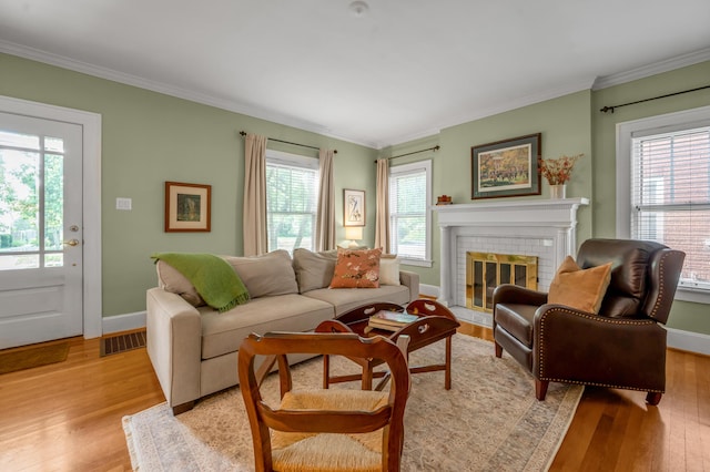 406 Dudley Rd, Lexington, KY 40502 - living room with light wood-type flooring, a brick fireplace, ornamental molding, and baseboards