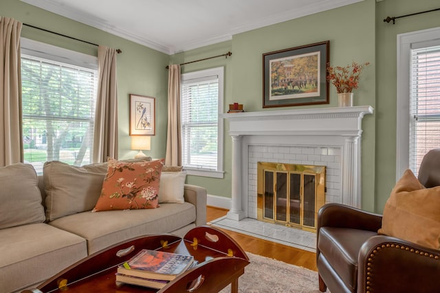 406 Dudley Rd, Lexington, KY 40502 - living room with wood finished floors, ornamental molding, plenty of natural light, a brick fireplace, and baseboards