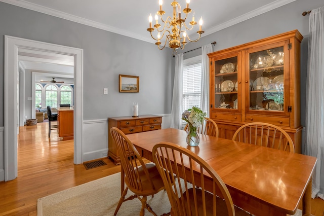 406 Dudley Rd, Lexington, KY 40502 - dining area with light wood-style floors, ornamental molding, and a chandelier