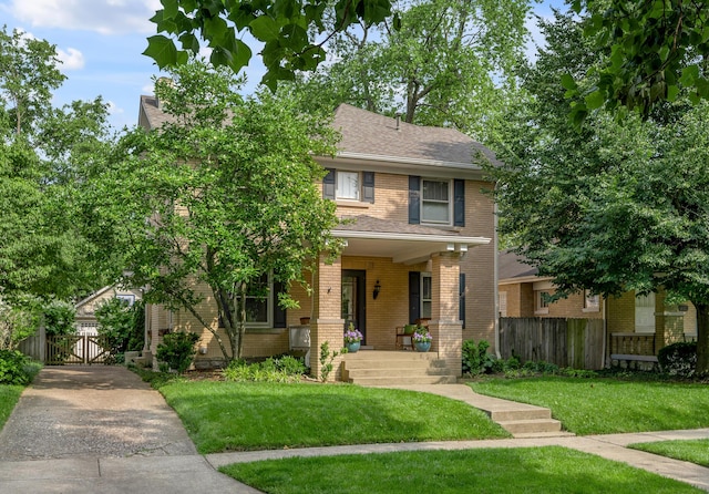 406 Dudley Rd, Lexington, KY 40502 - view of front of house featuring brick siding, a shingled roof, and a gate