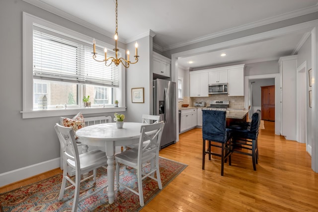 406 Dudley Rd, Lexington, KY 40502 - dining room featuring light wood finished floors, a chandelier, ornamental molding, baseboards, and recessed lighting