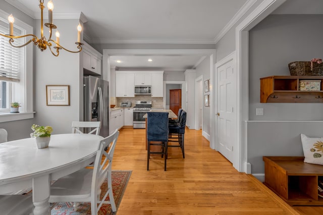 406 Dudley Rd, Lexington, KY 40502 - dining room with a chandelier, light wood-style floors, ornamental molding, and recessed lighting