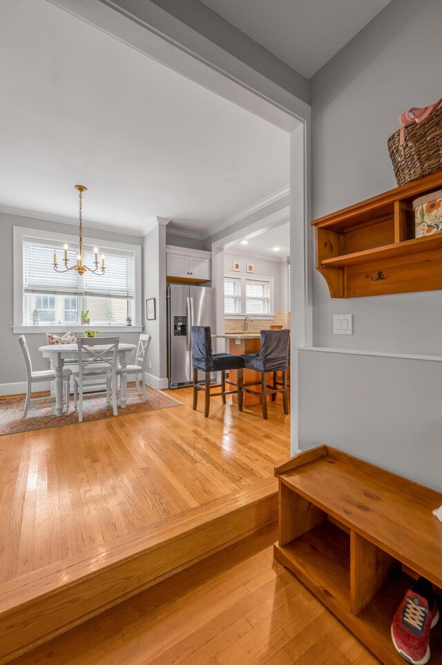 406 Dudley Rd, Lexington, KY 40502 - dining space with healthy amount of natural light, a chandelier, baseboards, and light wood-style floors