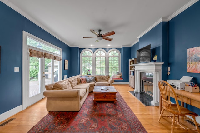 406 Dudley Rd, Lexington, KY 40502 - living room with healthy amount of natural light, a premium fireplace, ceiling fan, crown molding, and light wood finished floors