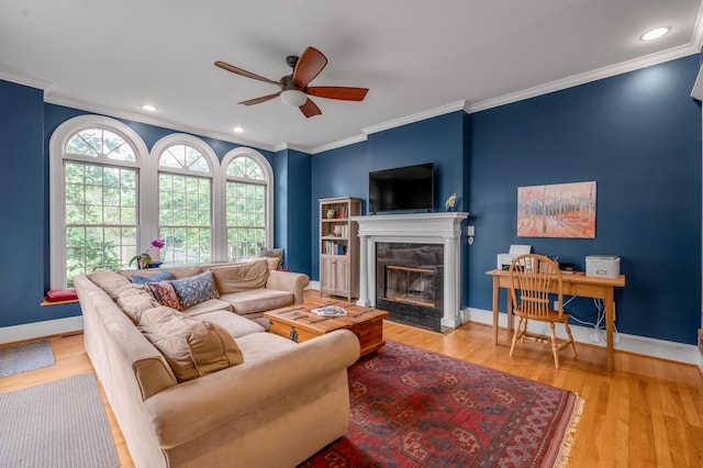 406 Dudley Rd, Lexington, KY 40502 - living area with a ceiling fan, ornamental molding, a tile fireplace, wood finished floors, and baseboards