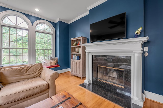406 Dudley Rd, Lexington, KY 40502 - living area featuring a fireplace with flush hearth, crown molding, wood finished floors, and baseboards