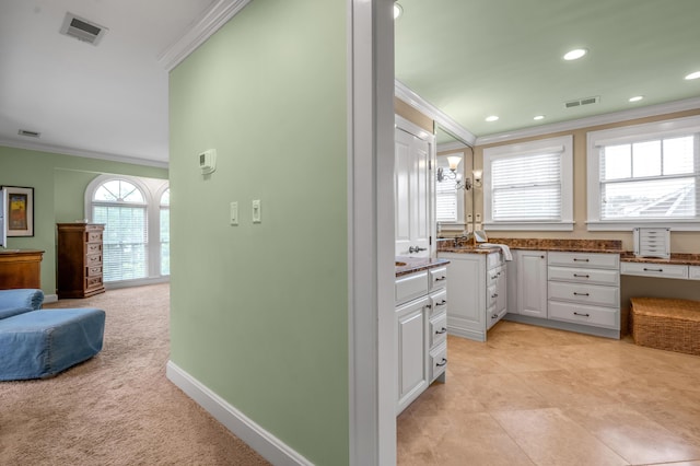 406 Dudley Rd, Lexington, KY 40502 - kitchen with crown molding, white cabinetry, recessed lighting, baseboards, and light colored carpet