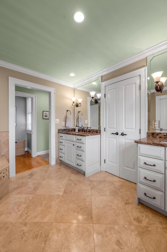 406 Dudley Rd, Lexington, KY 40502 - full bathroom with ornamental molding, two vanities, a chandelier, and tile patterned flooring