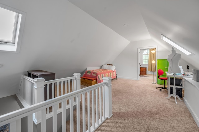 406 Dudley Rd, Lexington, KY 40502 - carpeted bedroom featuring vaulted ceiling, a skylight, a nursery area, and baseboards