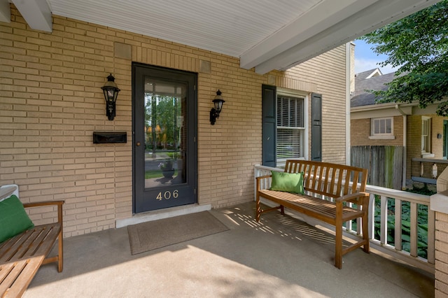 406 Dudley Rd, Lexington, KY 40502 - view of exterior entry with covered porch and brick siding