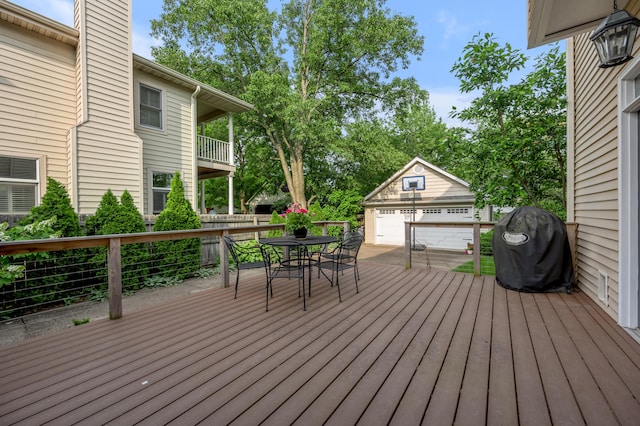 406 Dudley Rd, Lexington, KY 40502 - deck featuring a garage, an outdoor structure, grilling area, and outdoor dining space