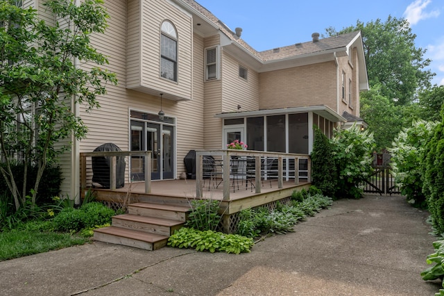 406 Dudley Rd, Lexington, KY 40502 - back of property featuring a sunroom, a wooden deck, and a gate
