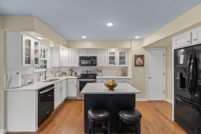 850 Charwood Dr, Lexington, KY 40515 - kitchen with black appliances, a sink, light countertops, white cabinets, and recessed lighting