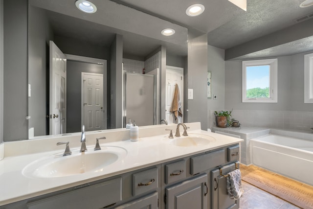 850 Charwood Dr, Lexington, KY 40515 - full bath with a stall shower, double vanity, a bath, tile patterned floors, and recessed lighting