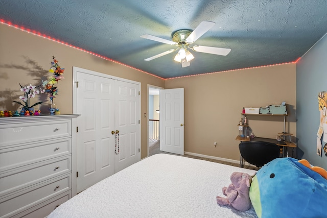 850 Charwood Dr, Lexington, KY 40515 - carpeted bedroom featuring baseboards, a ceiling fan, a textured ceiling, and a closet