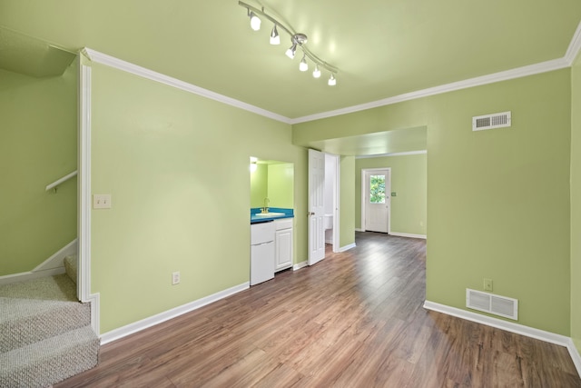 850 Charwood Dr, Lexington, KY 40515 - unfurnished living room featuring crown molding, baseboards, wood finished floors, a sink, and stairs