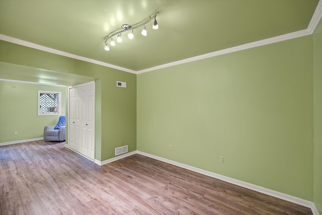 850 Charwood Dr, Lexington, KY 40515 - unfurnished room featuring baseboards, wood finished floors, and ornamental molding