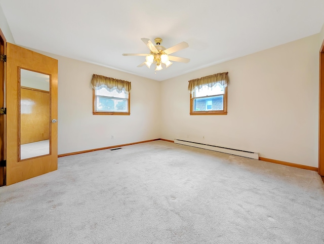 227 Mimosa Ave, Somerset, KY 42503 - unfurnished room with a baseboard radiator, plenty of natural light, a ceiling fan, and carpet flooring