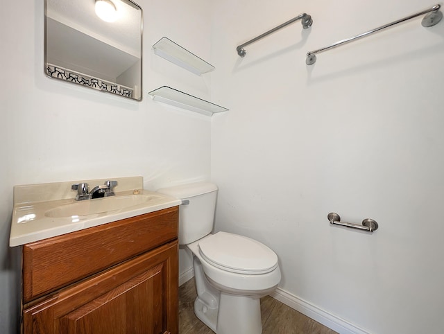 227 Mimosa Ave, Somerset, KY 42503 - bathroom with toilet, vanity, baseboards, and wood finished floors