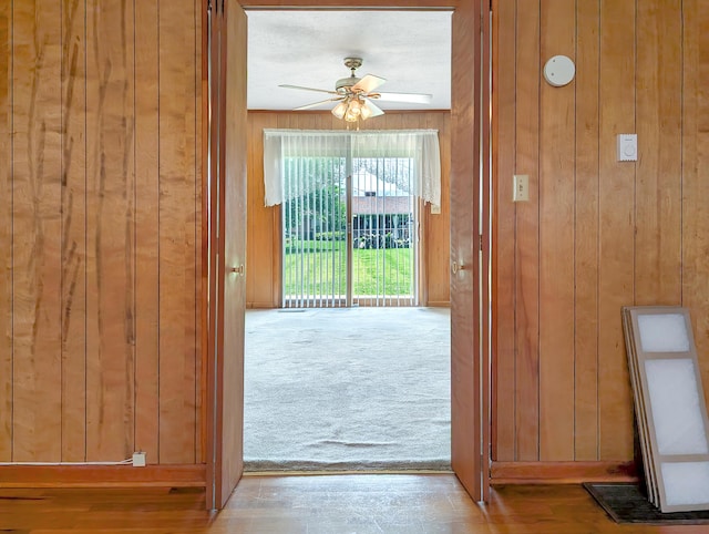 227 Mimosa Ave, Somerset, KY 42503 - doorway featuring wood walls, ceiling fan, and carpet