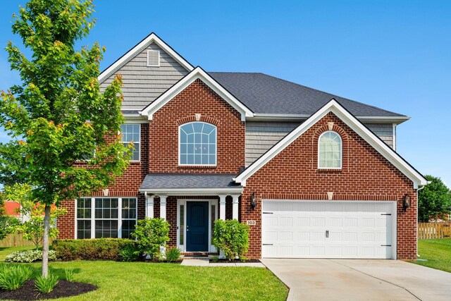 103 Snap Hook Ct, Georgetown, KY 40324 - traditional home with brick siding, a front lawn, driveway, and a garage