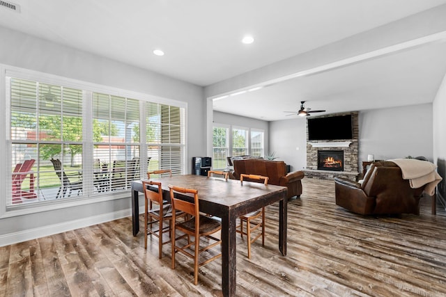 103 Snap Hook Ct, Georgetown, KY 40324 - dining space with a large fireplace, wood finished floors, a ceiling fan, baseboards, and recessed lighting