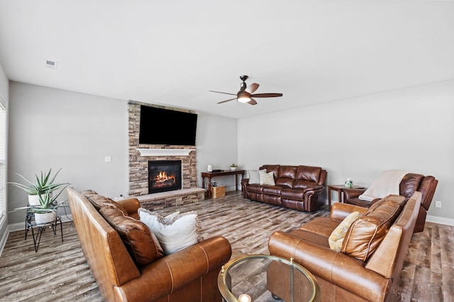 103 Snap Hook Ct, Georgetown, KY 40324 - living room featuring wood finished floors, a ceiling fan, baseboards, and a stone fireplace