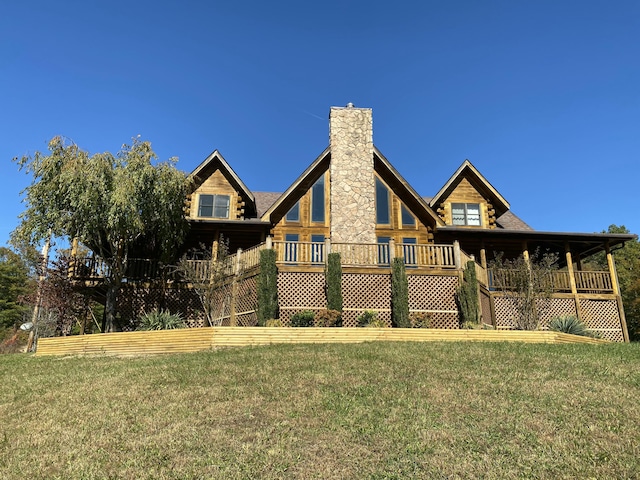 431 Harold Luke Rd, Campton, KY 41301 - back of house featuring a chimney, a lawn, and log exterior