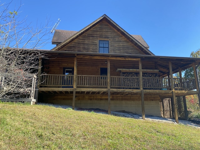 431 Harold Luke Rd, Campton, KY 41301 - view of front facade with a deck, a front yard, log exterior, and roof with shingles